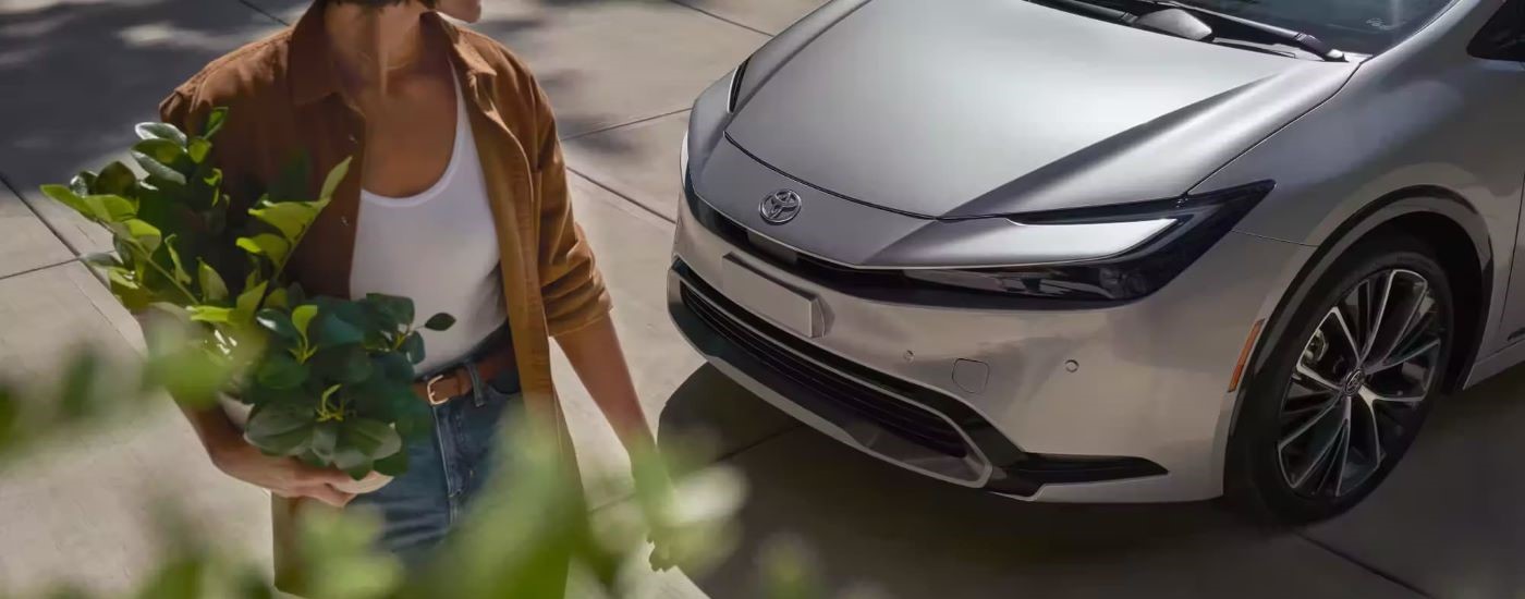 A close up shows the front of a silver 2023 Toyota Prius for sale.