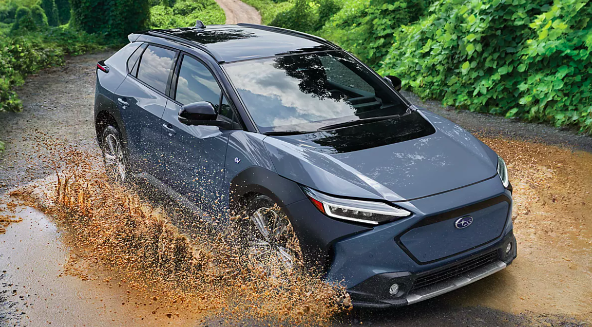 new subaru solterra jets through mud outdoors