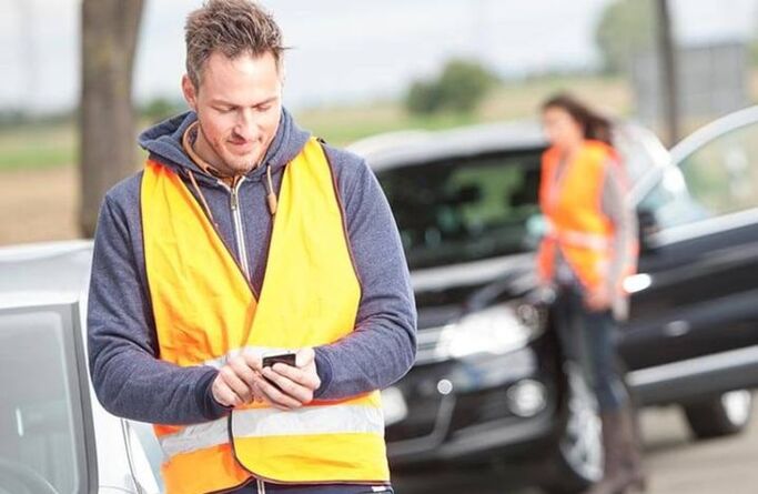 Roadside assistance workers helping a driver
