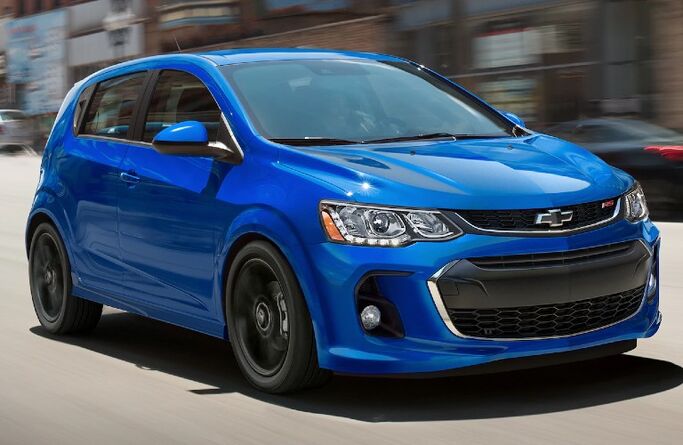 Front passenger angle of a blue 2020 Chevrolet Sonic hatchback