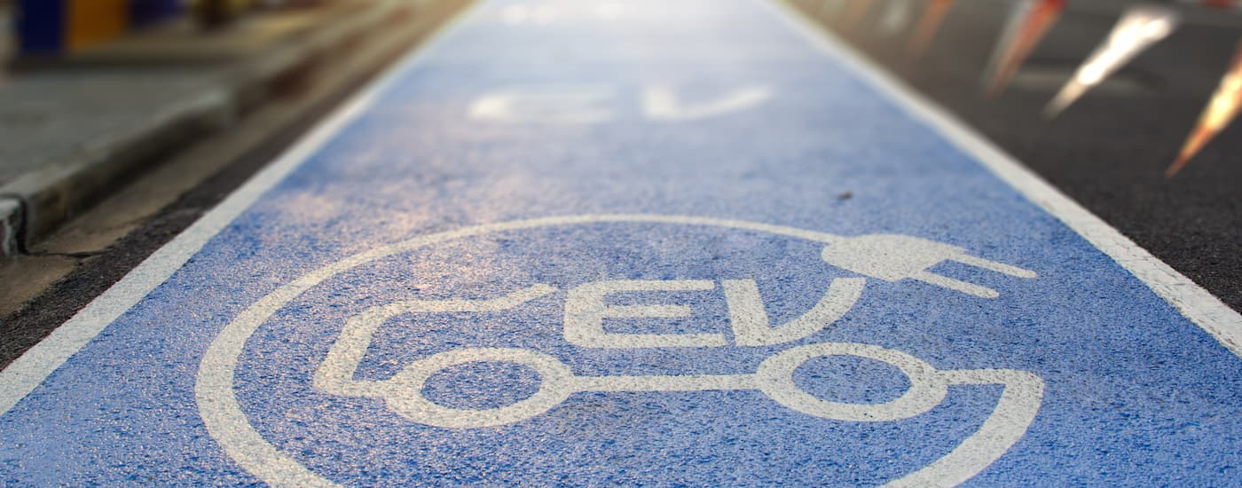 A blue painted electric vehicle charging parking spot is shown.