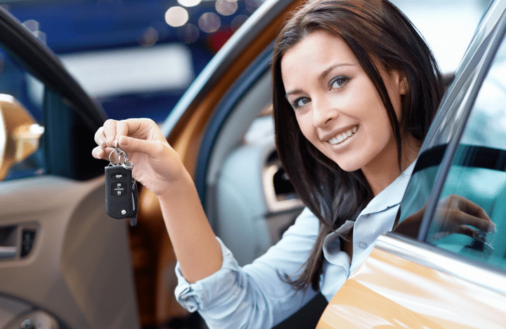 A woman showing the key