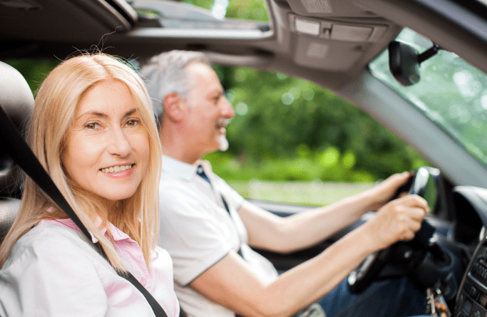 A man and woman in a car
