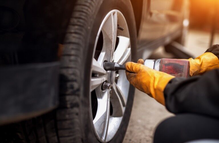 Mechanic replacing a tire