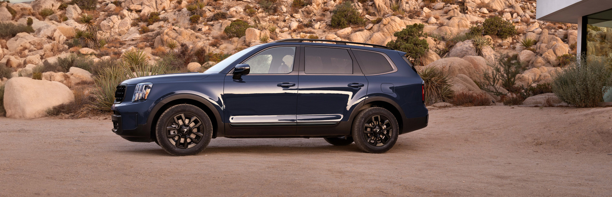 The hood of this SUV is almost as tall as the small car. I wonder