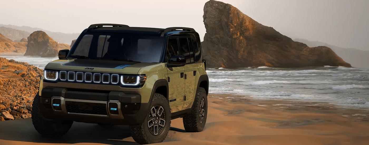 A green 2024 Jeep Recon EV is shown parked on a beach.