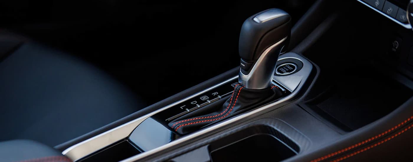 A close up of the shifter in a 2024 Nissan Sentra SR is shown in the park position.