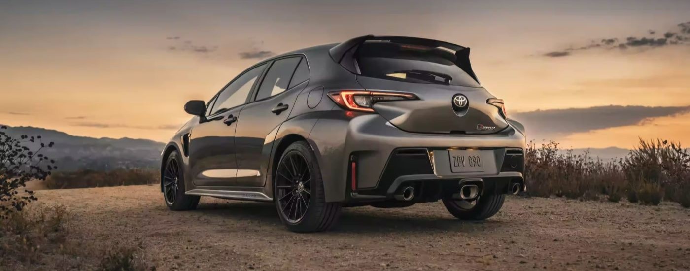 A grey 2023 Toyota GR Corolla Circuit Edition is shown from the rear at dusk.