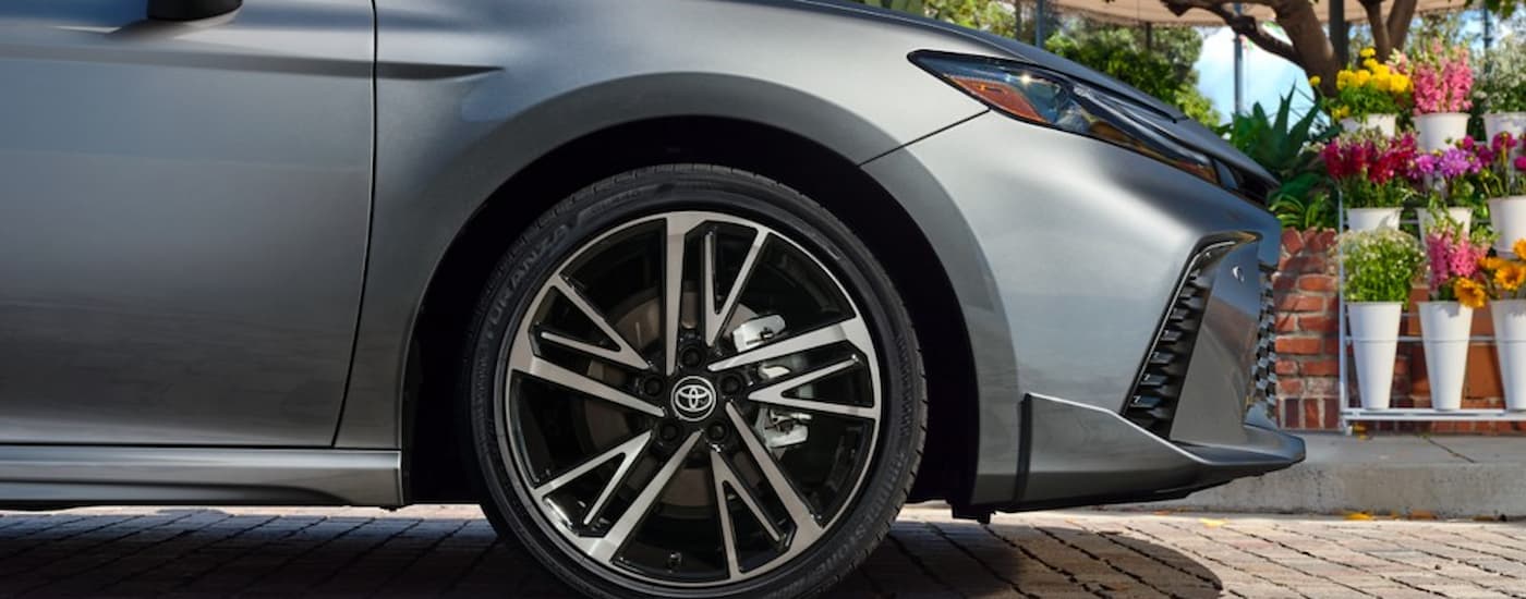 A close up of the side tire on a silver 2025 Toyota Camry for sale in Sacramento is shown.