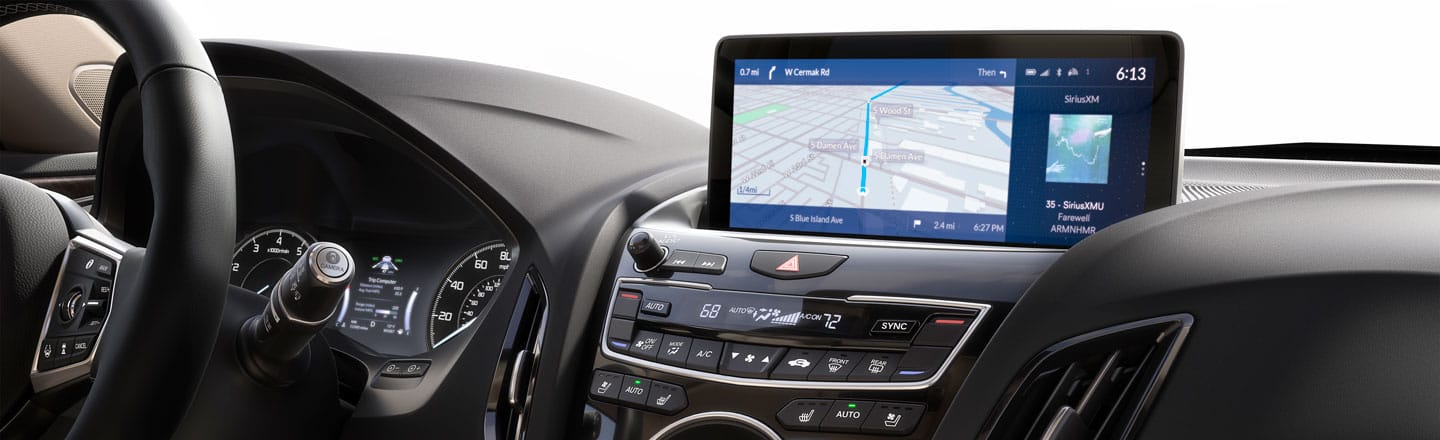A car dashboard with a screen that says 6:15 on it