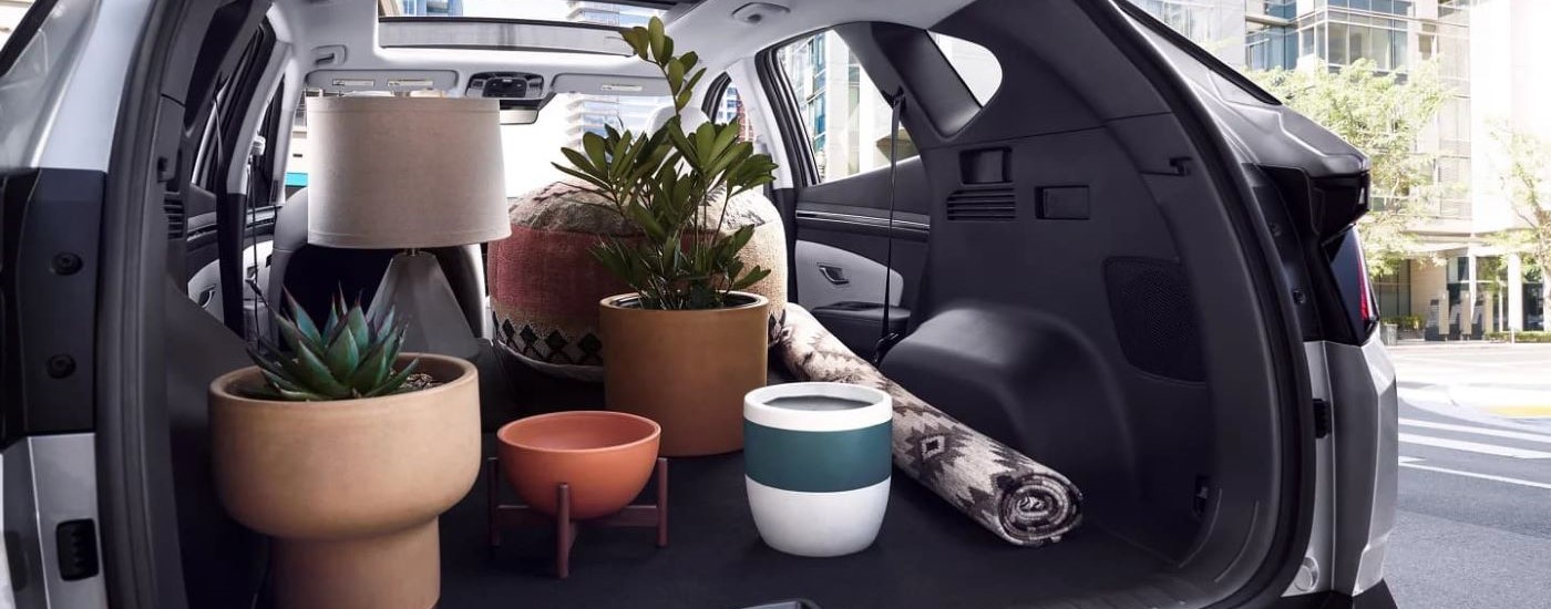 A close up of the rear cargo storage area of a 2023 Hyundai Tucson is shown.