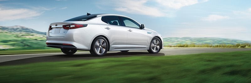 White Kia Vehicle Driving