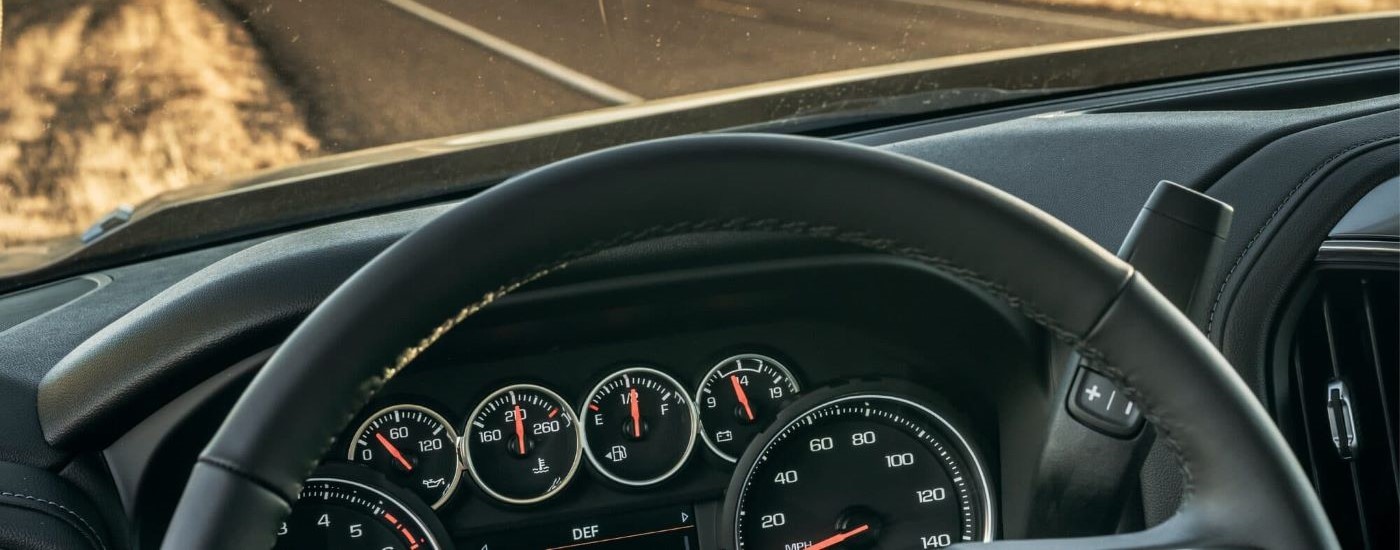 The gauges and black dash are shown in a 2022 Chevy Silverado 1500 RST.
