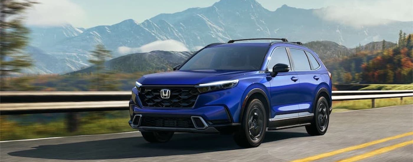 A blue 2023 Honda CR-V is shown from the front at an angle after leaving an Elk Grove Honda dealer.