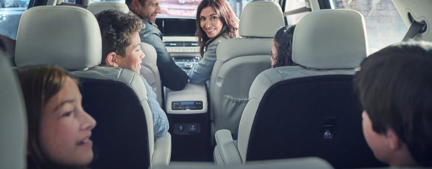 A family is shown in a 2020 Hyundai Palisade.