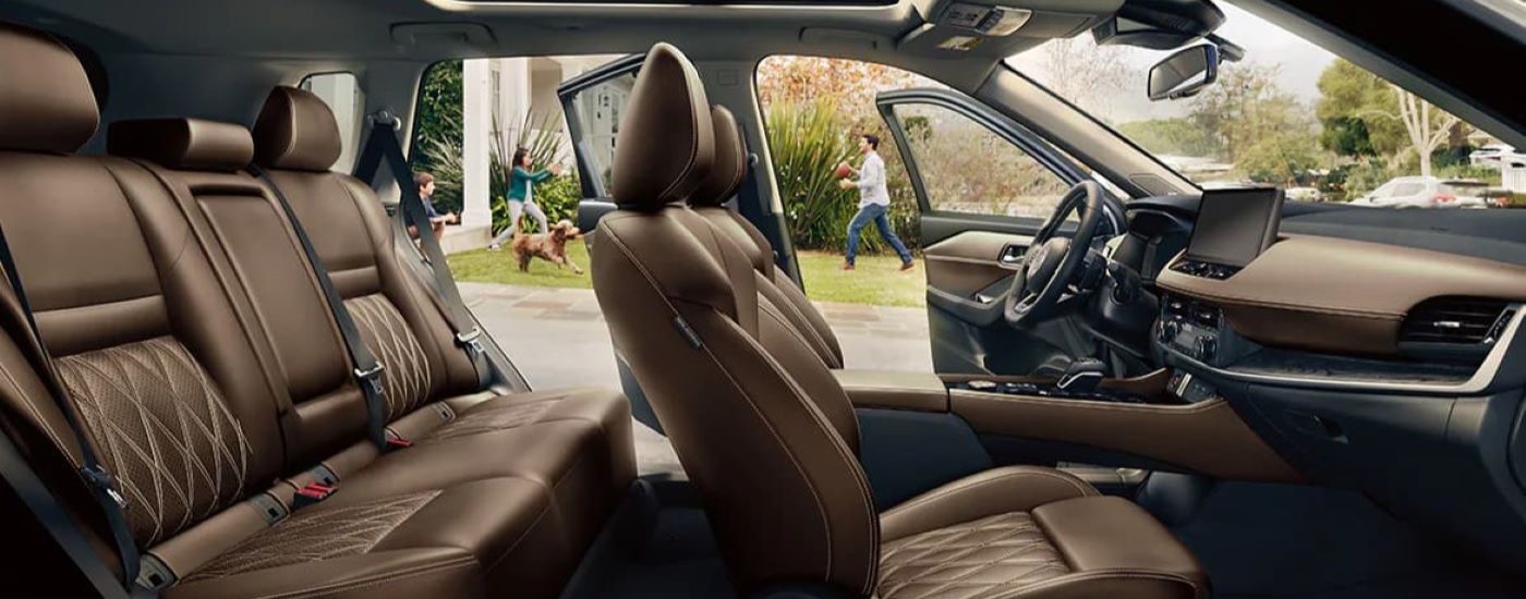 The brown leather seats are shown in 2024 Nissan Rogue.