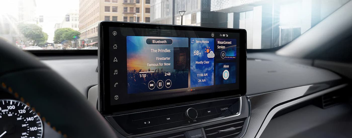 A close up of the infotainment screen in a 2024 Nissan Altima for sale is shown.