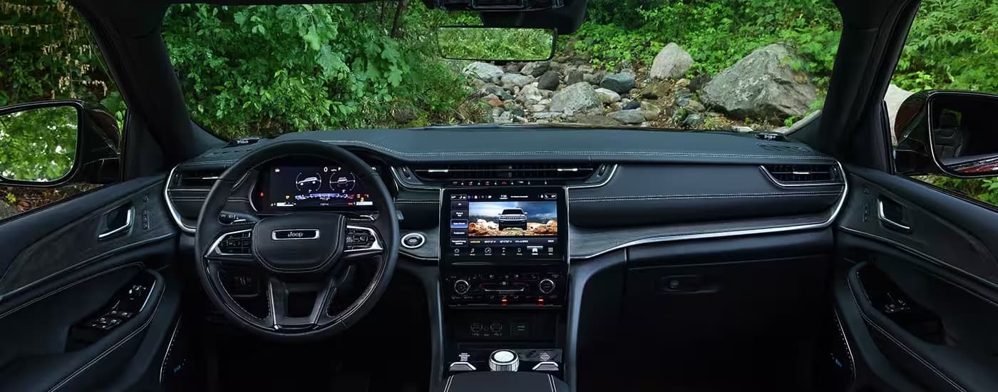 The black dash of a 2024 Jeep Grand Cherokee L is shown from above the center console.