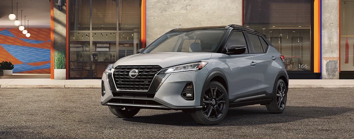 A grey 2024 Nissan Kicks is shown from the front at an angle.