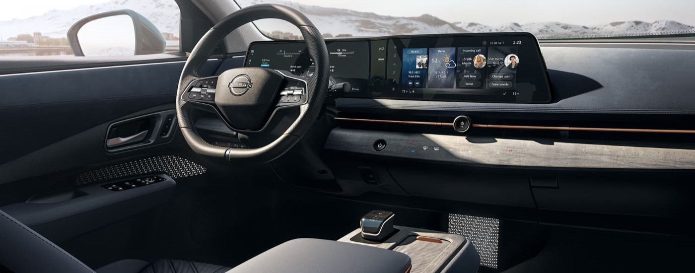 The black interior and dash are shown in a 2023 Nissan ARIYA.