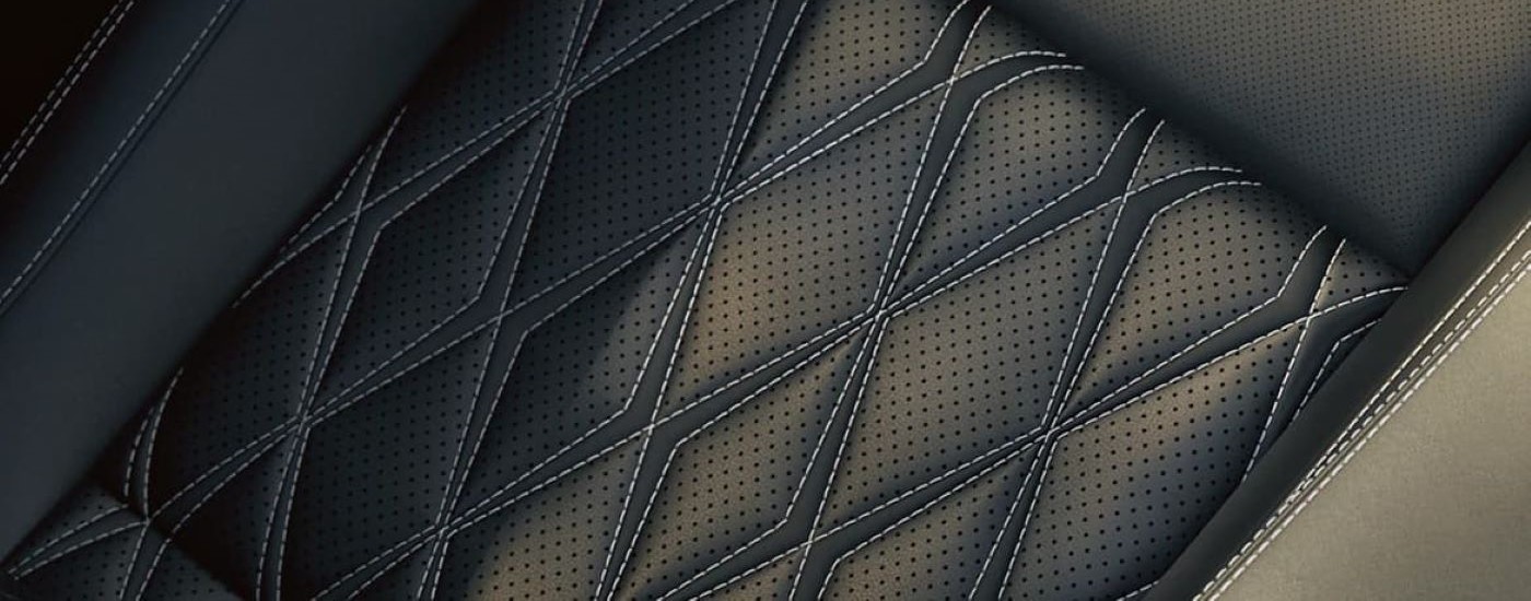 A close up shows the leather seat and stitching in a 2023 Nissan Rogue.