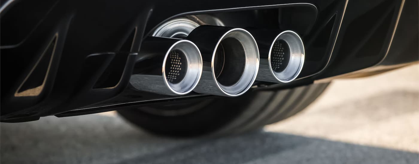 A close up of the exhuast on a black 2024 Honda Civic Type R is shown.