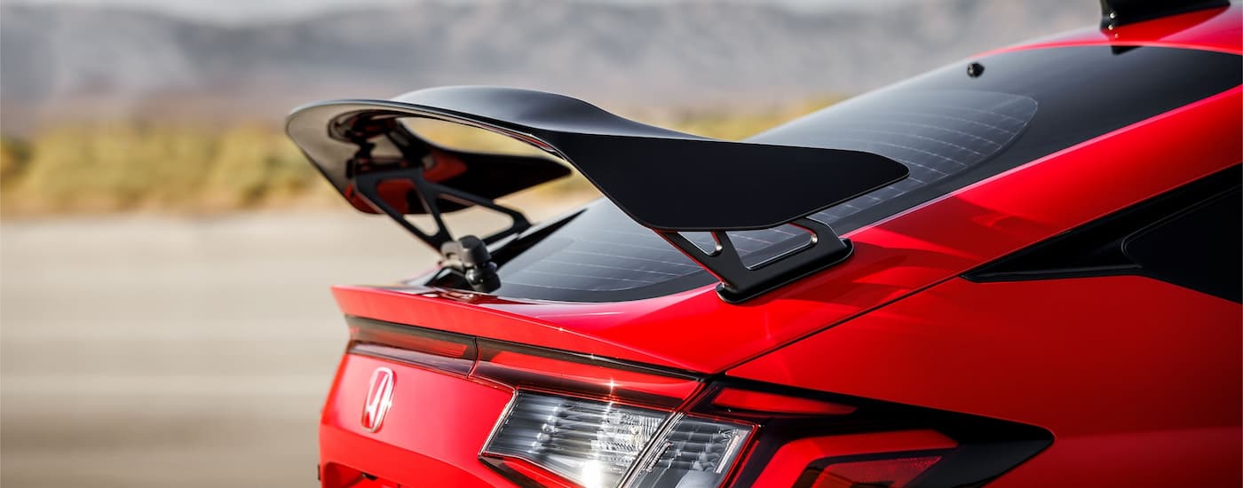 The rear of a red 2024 Honda Civic Type R is shown.