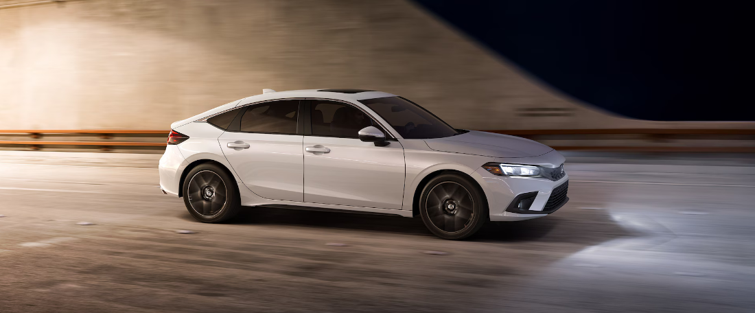 2024 Honda Civic Hatchback Sport Touring shown in Platinum White Pearl.