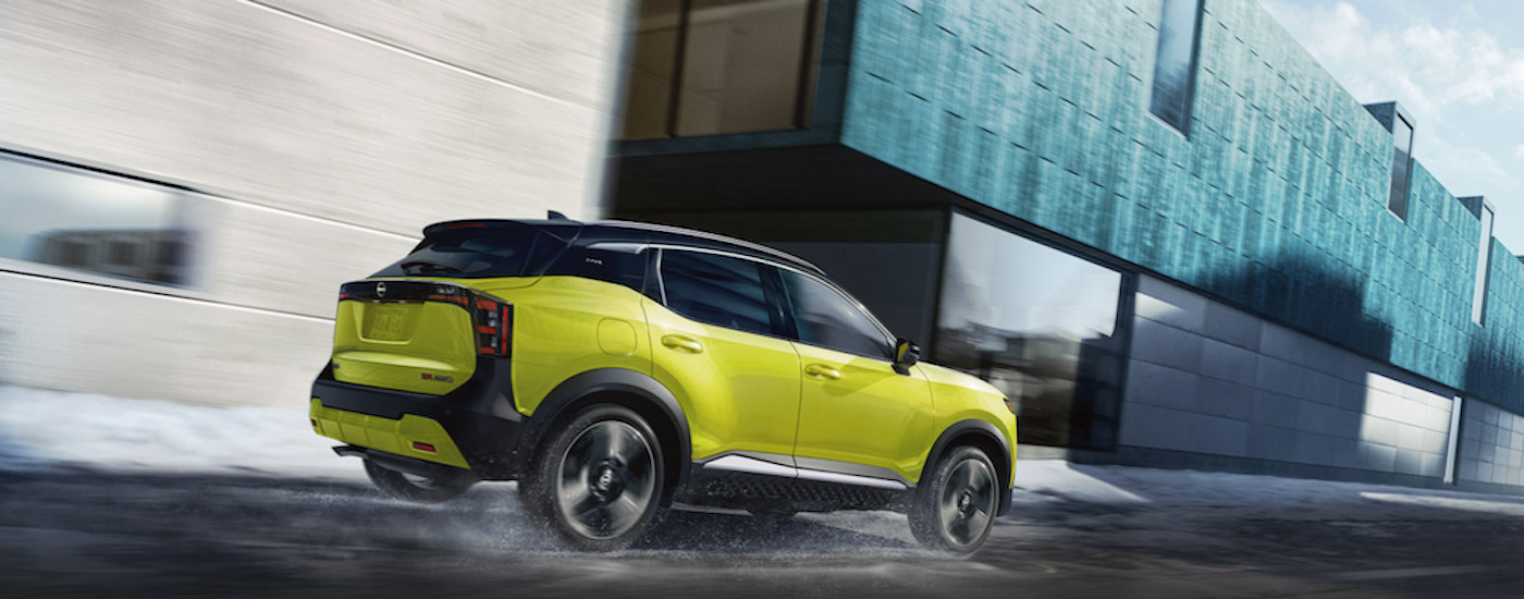 A green2025 Nissan Kicks SR is shown from the side.