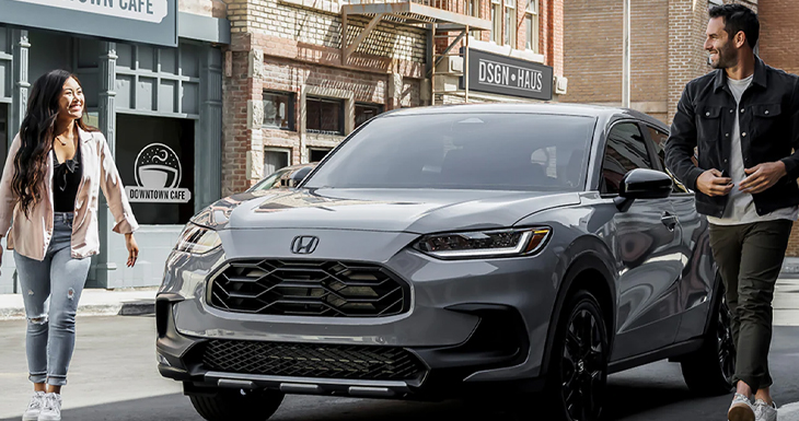 The couple walking home after picking up their new honda vehicle