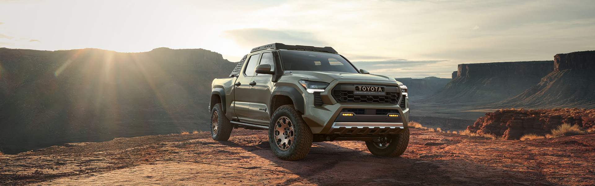 2024 Toyota Tacoma vs. 2024 Ford Ranger at Tri County Toyota | 2024 Toyota Tacoma Bronze Edition Parked on Mountain Overlook