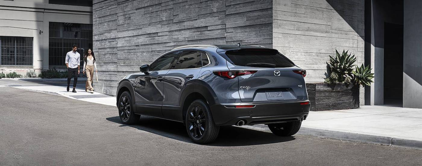 A grey 2023 Mazda CX-30 is shown from the rear at an angle.