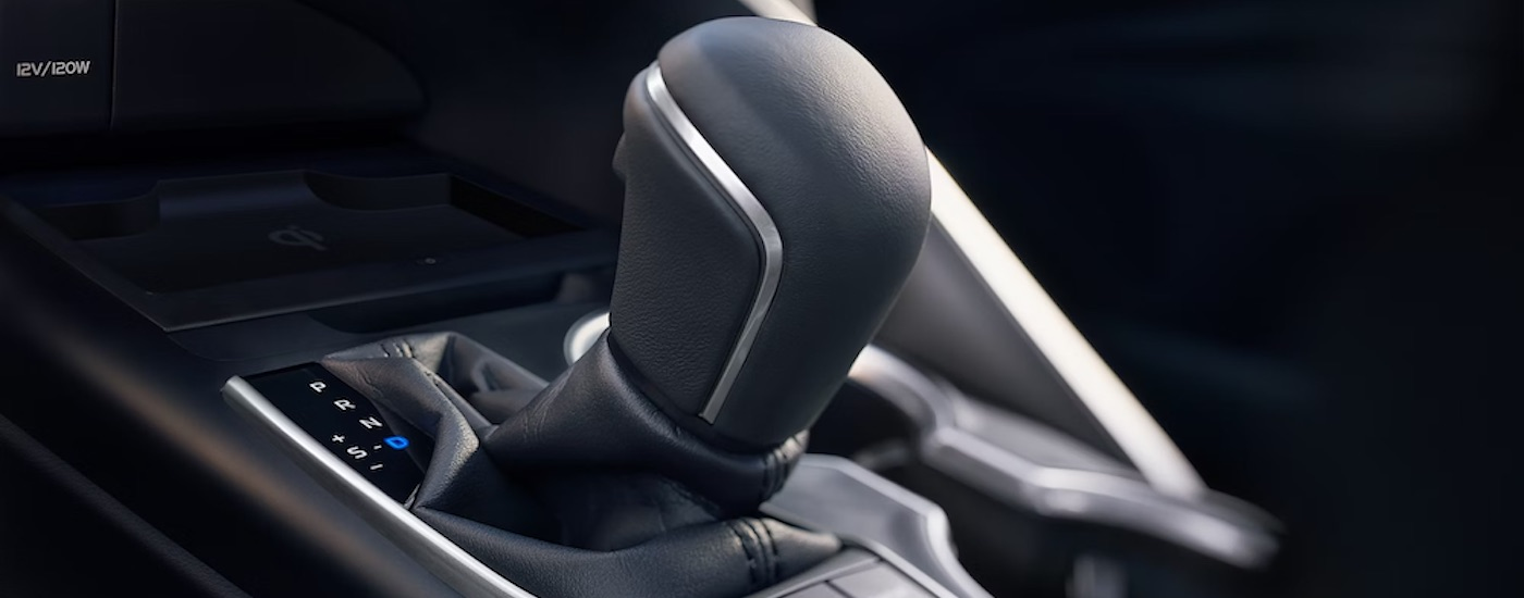 The black shifter of a 2024 Toyota Camry is shown in close-up.