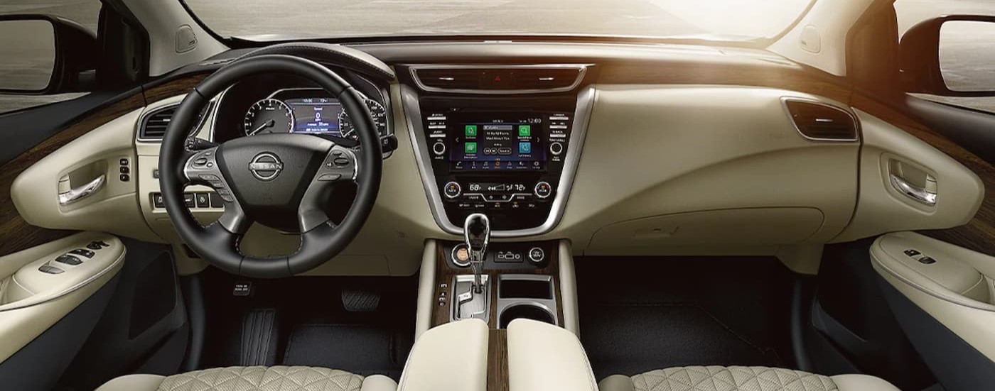 The white and gray interior and dash in a 2024 Nissan Murano is shown.