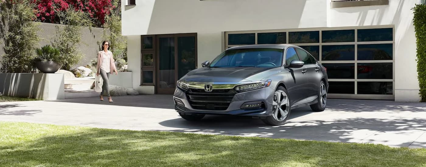 A gray 2020 Honda Accord Touring is shown parked on a driveway.
