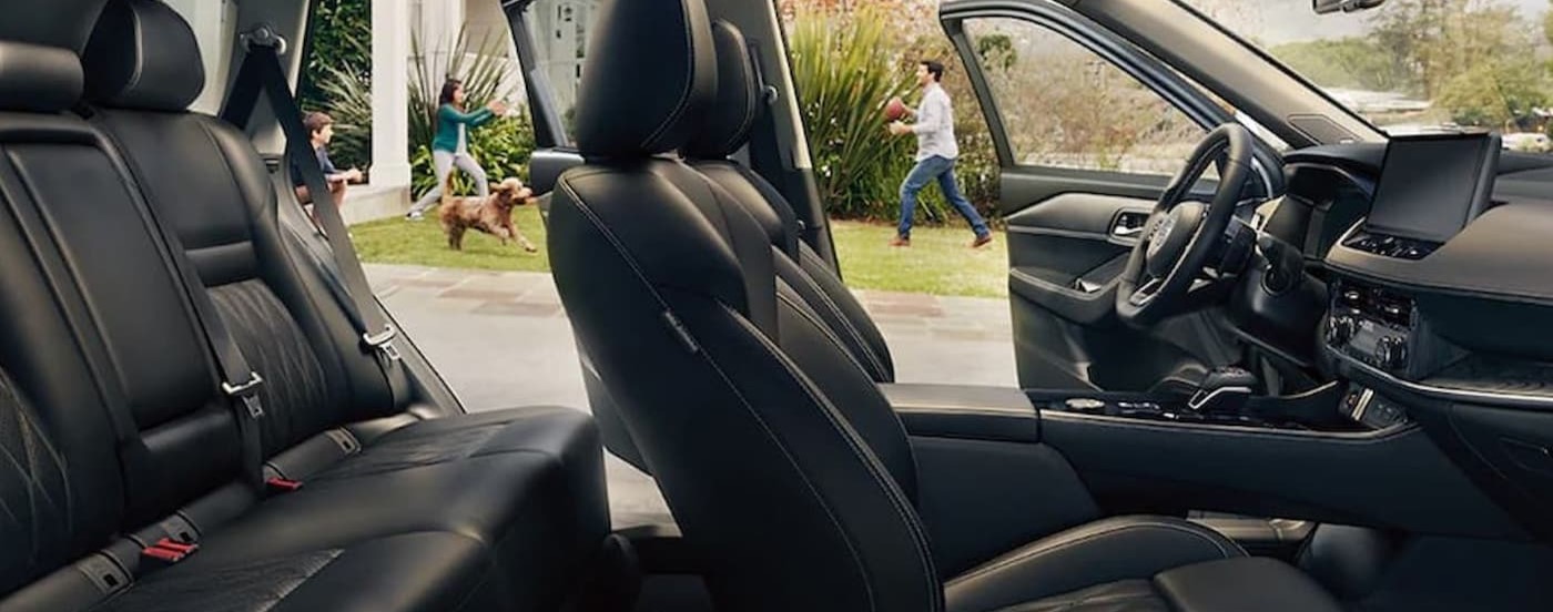 The black interior and dash in a 2024 Nissan Rogue is shown.
