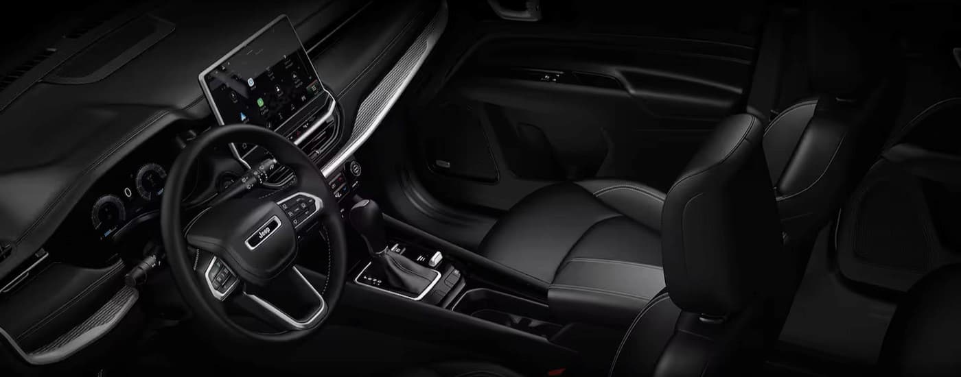 The black interior and dash in a 2024 Jeep Compass.