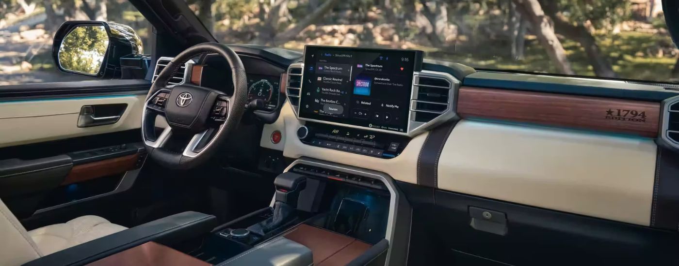 The tan and black interior is shown in a 2024 Toyota Tundra 1974 Edition.