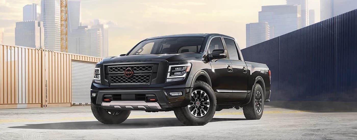 A black 2024 Nissan Titan is shown from the front at an angle.