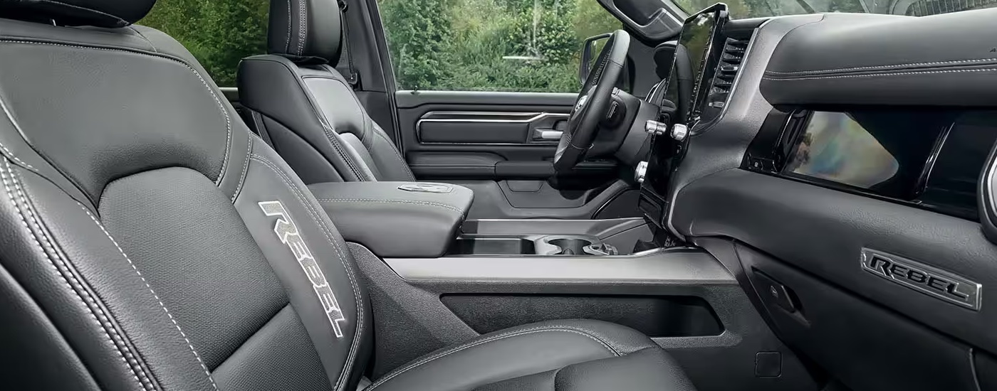 The front seats in a 2025 Ram 1500 Rebel at a Ram dealer.