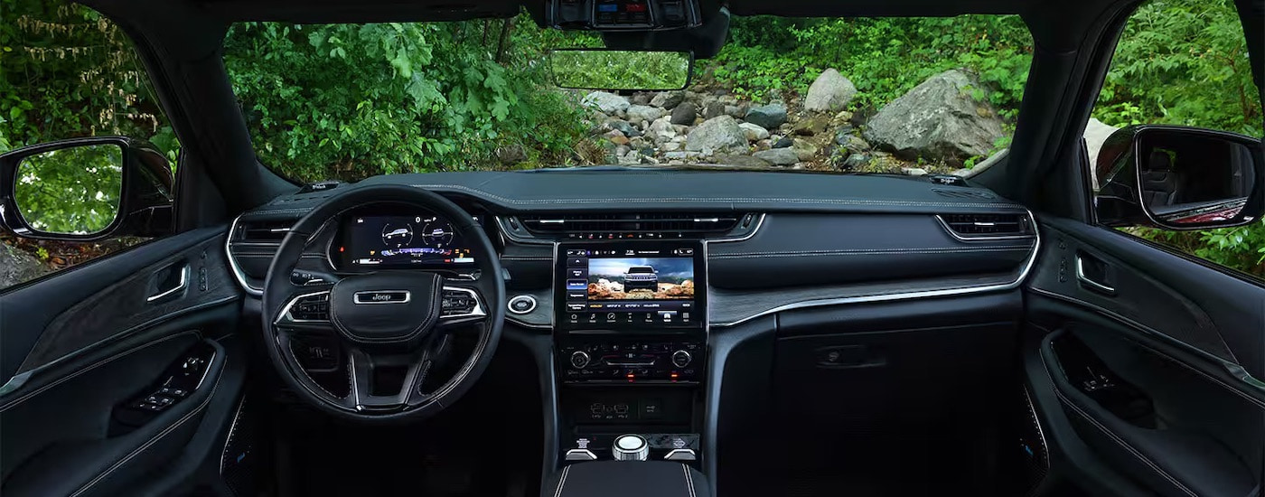 The black interior of a 2023 Jeep Grand Cherokee.