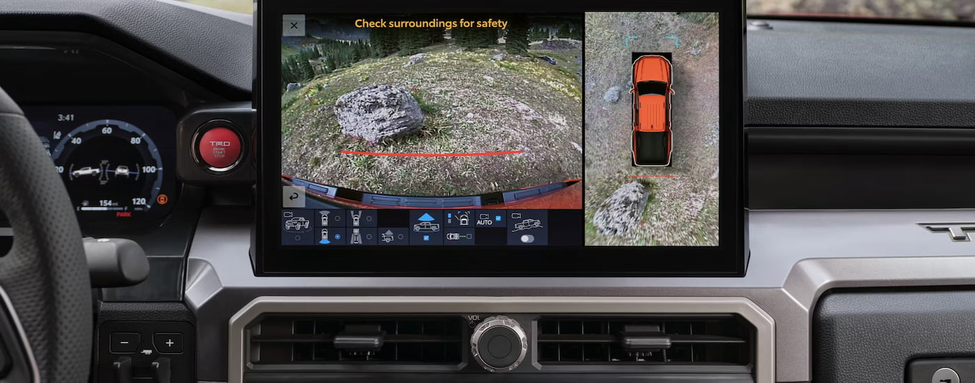 The Trailhunter trim's 360-degree camera view shown on the infotainment screen of a 2024 Toyota Tacoma for sale.