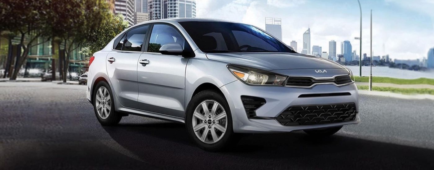 A used car for sale, a silver 2021 Kia Rio.