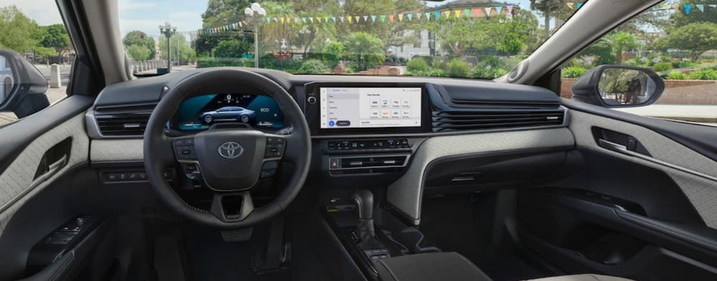 The interior of a 2024 Toyota Camry is shown from the driver's seat.