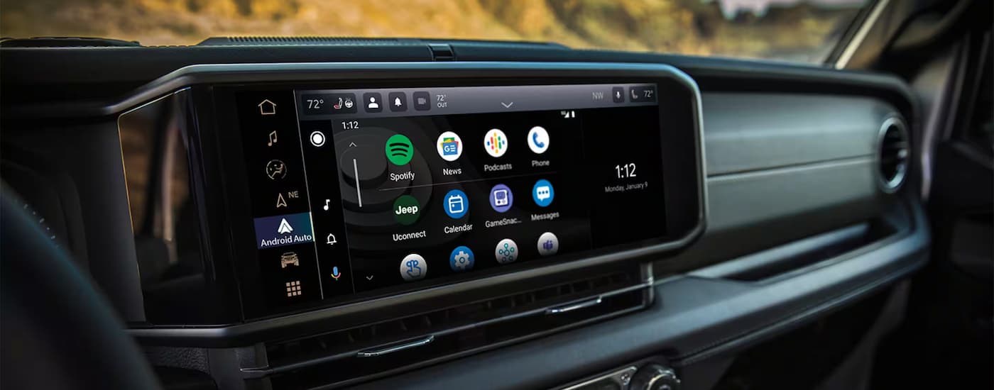 A close up of the infotainment screen on the dashboard of a 2025 Jeep Wrangler for sale.