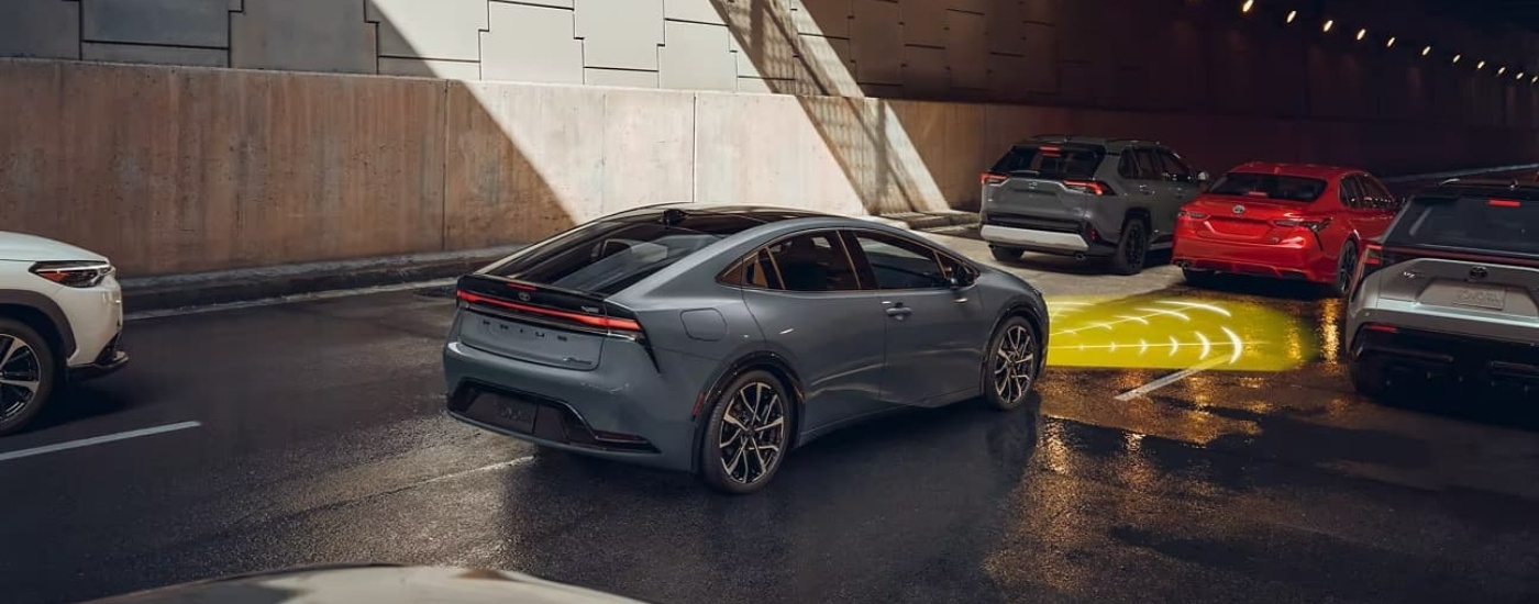 A grey 2023 Toyota Prius Prime XSE Premium is shown with simulated sensor lines.