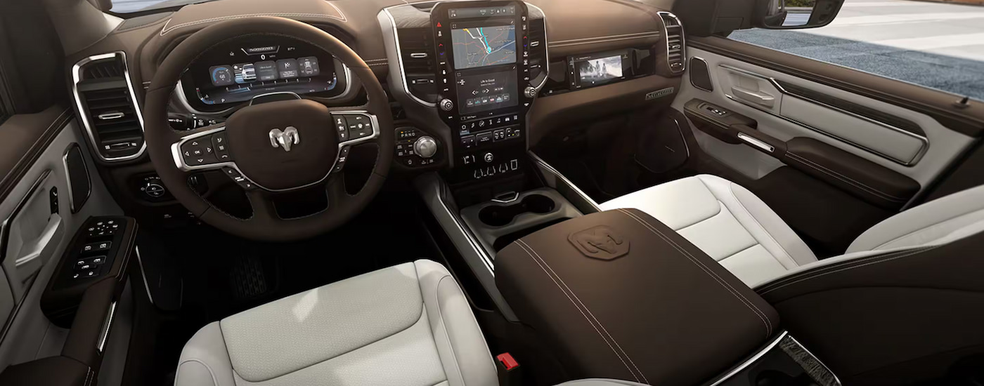 The brown leather interior of a 2025 Ram 1500 Laramie at a Ram dealer near Cypress.