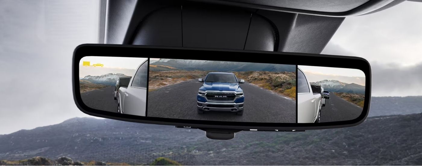 Close-up of the digital rearview mirror in a 2024 Ram 2500 driving to a Ram dealer near Brookshire.