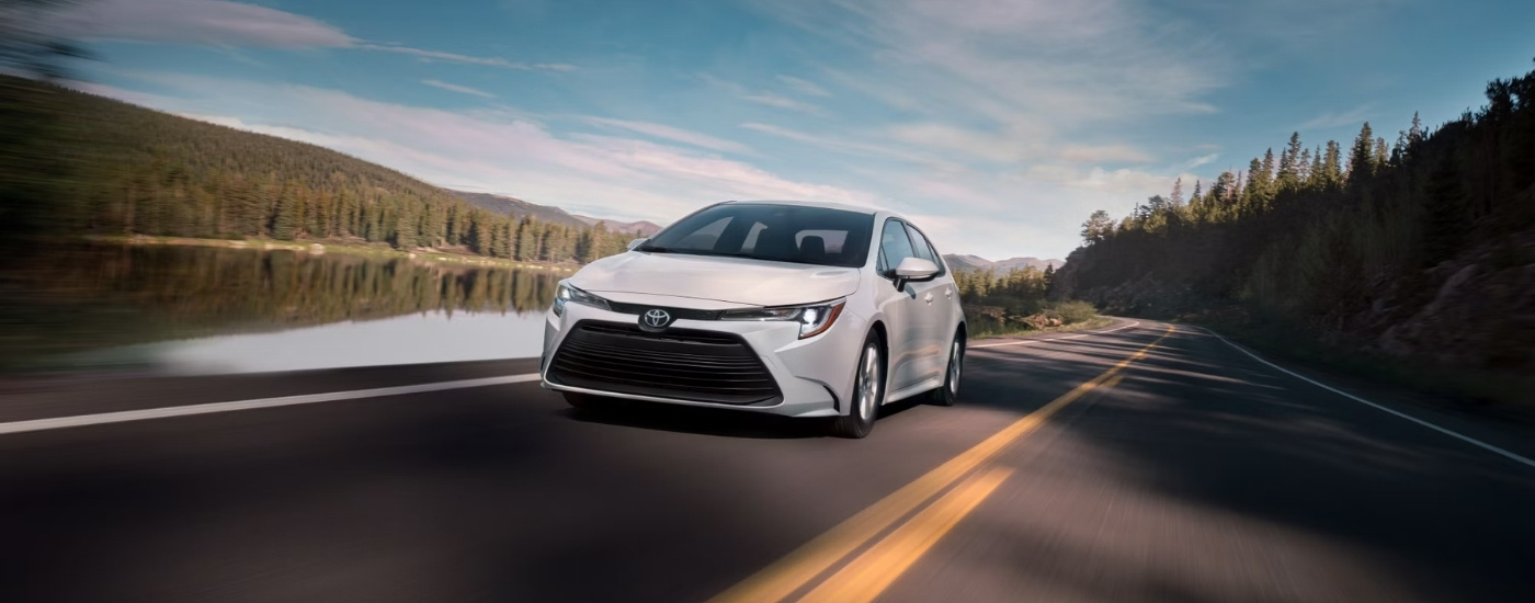 A white 2024 Toyota Corolla is shown from the front at an angle.