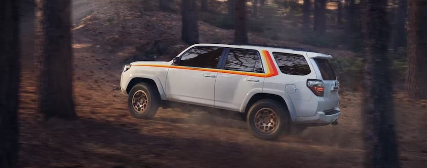 A white 2023 Toyota 4Runner TRD Anniversary Edition is shown from the side.